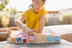 The Freckled Frog Playing with Planets